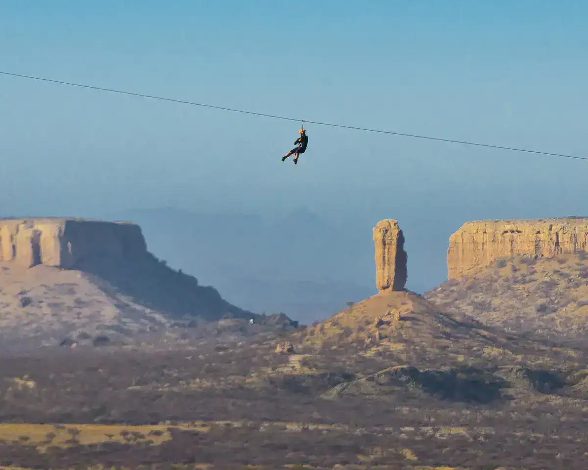 Zip lining near Vingerklip Namibia with the Ugab Terraces in the background